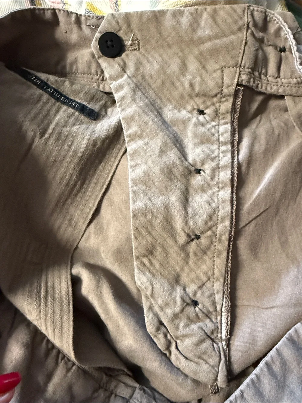 AllSaints trousers with a pleated front and a button closure